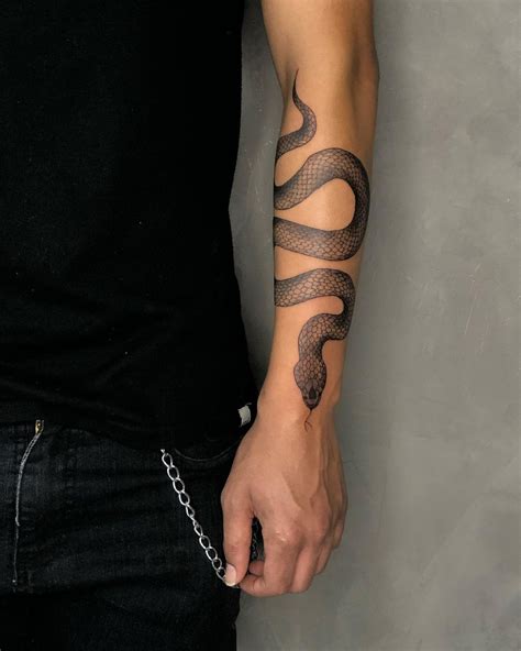 arm snake tattoo|snake arm tattoos men.